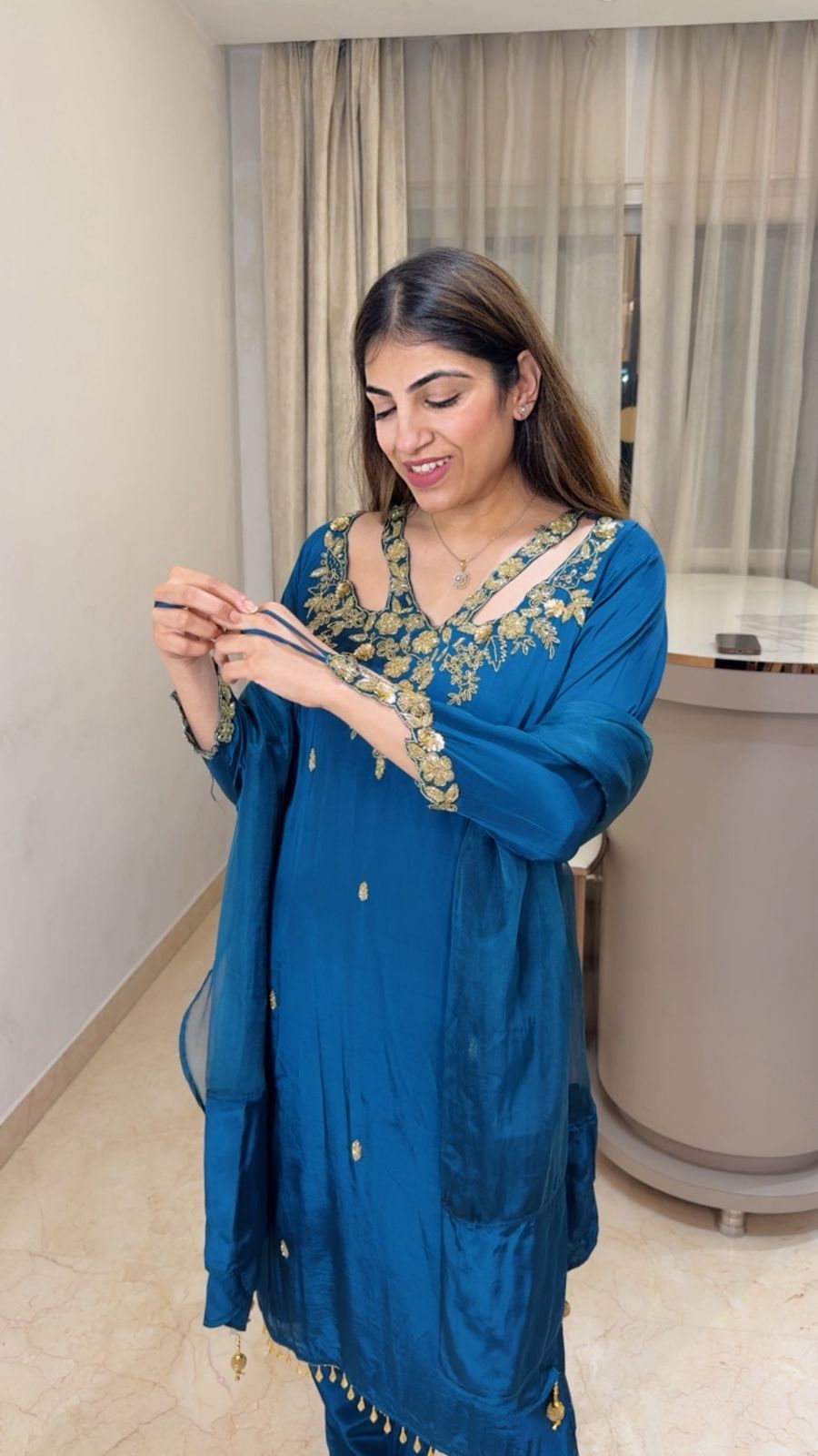 Crepe suit with complete handwork with designer neck line and sleeve paired with organza duppatta