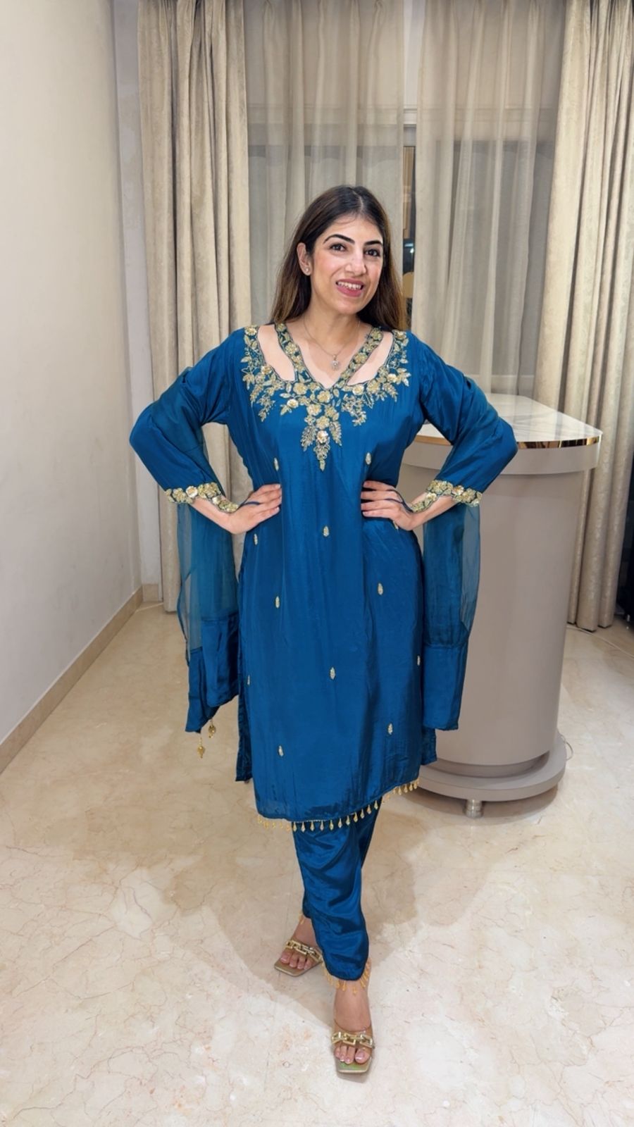 Crepe suit with complete handwork with designer neck line and sleeve paired with organza duppatta